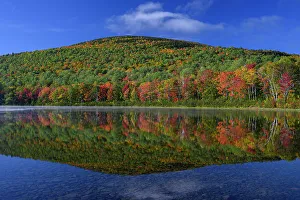 USA, Maine. Colorful foliage reflected in South Branch Pond, Baxter State Park
