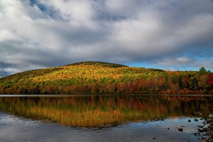 Images Dated 4th May 2024: USA, Maine. Fall foliage and mountain reflection on pond, Baxter State Park