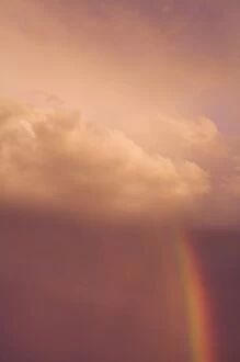 USA, Maine, Harpswell. Rainbow descends through a stormy sky. Credit as: Kathleen
