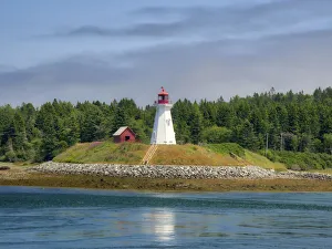 Images Dated 7th April 2020: USA, Maine, Lubec. Mulholland Point Lighthouse as seen from the town of Lubec, Maine