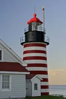 Images Dated 13th August 2006: USA, Maine, Lubec. West Quoddy Head Lighthouse, Quoddy Head State Park, near sunset
