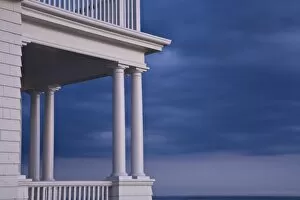 USA, Maine, Marshall Point. Stormy sky behind a porch