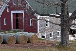 Roll Prints: USA, Maine, New Gloucester. Hay bales sitting outside a barn at Shaker Village