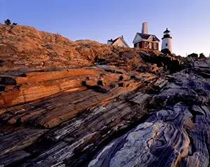 Lincoln County Prints: USA, Maine, Pemaquid Light. A pink sunrise washes the rocks near Pemaquid Light