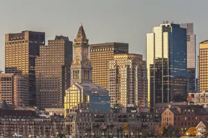 USA, Massachusetts, Boston. City skyline from Boston Harbor at dawn