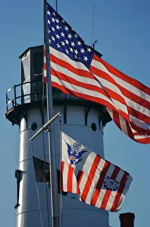 Nautical Prints: USA, Massachusetts, Chatham. An American flag and the Coast Guard flag wave in front
