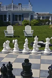 Giant Prints: USA, Massachusetts, Chatham. Looking towards chairs and buildings from a giant chess