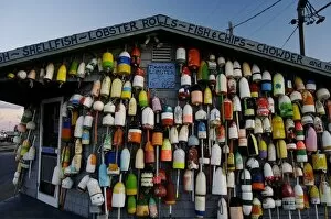Images Dated 23rd November 2007: USA, Massachusetts, Provincetown. Buoys crowd together on a seafood shack