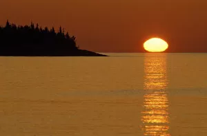 Images Dated 6th June 2007: USA, Michigan, Isle Royale National Park, Spring sunrise silhouettes Edwards Island