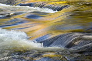 Movement Prints: USA, Michigan, Upper Peninsula, Bond River with autumn reflections abstract