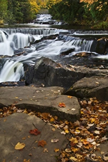 USA, Michigan, Upper Peninsula. Bond Falls and fall foliage