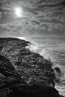 Black And White Prints: USA. Molten lava flows into the ocean at sunrise in Volcanoes NP on the Big Island of Hawaii