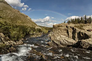 USA, Montana, Glacier National Park. Rainbow above Swiftcurrent Falls