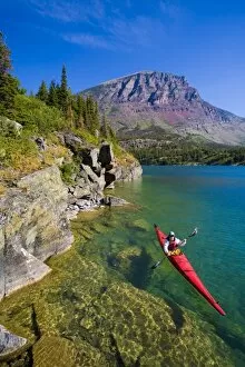 Images Dated 28th July 2007: USA, Montana, Glacier National Park, Woman sea kayaker on St. Mary Lake. (MR)