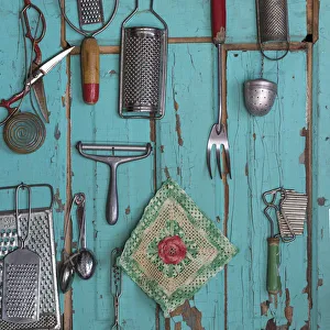 USA, Montana, Missoula. Old fashioned kitchen implements displayed on weathered door