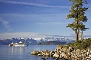 USA, Nevada, Lake Tahoe. A paddleboat moves across the lake