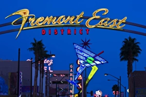 USA, Nevada, Las Vegas. Fremont East Area, neon casino signs, dusk