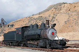 Railroad Prints: USA, Nevada. Old steam train engine in historic Gold Hill train station