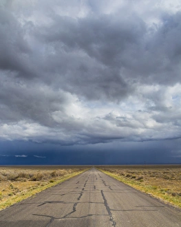 Two Lane Prints: USA, Nevada. Road into approaching storm