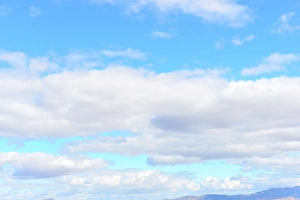 Nevada Prints: USA, Nevada, Wells, Cumulus Clouds in blue sky