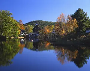 Orderly Prints: USA, New Hampshire, Ashland. Old grist mill building reflecting in pond. Credit as