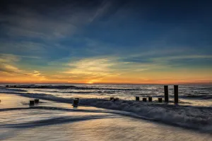 Images Dated 16th February 2018: USA, New Jersey, Cape May National Seashore. Sunrise on winter shoreline. Credit as