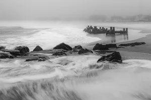 Images Dated 3rd February 2019: USA, New Jersey, Cape May National Seashore. Black and white of beach waves and old pier