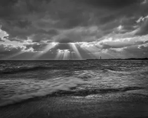 USA, New Jersey, Cape May National Seashore. B&W of sunset on ocean shore