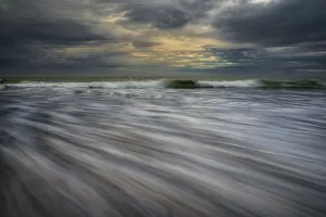Images Dated 26th February 2020: USA, New Jersey, Cape May National Seashore. Ocean waves on beach at sunset