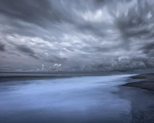 Images Dated 29th April 2021: USA, New Jersey, Cape May National Seashore. Sunrise storm clouds over shoreline