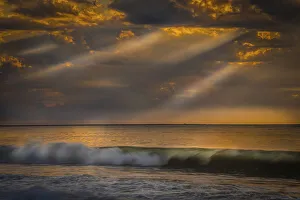 Images Dated 26th May 2021: USA, New Jersey, Cape May National Seashore. Sunlight through storm clouds over ocean