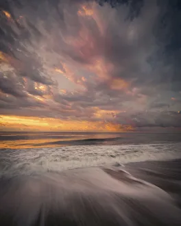Images Dated 29th April 2021: USA, New Jersey, Cape May National Seashore. Sunrise storm clouds over shoreline