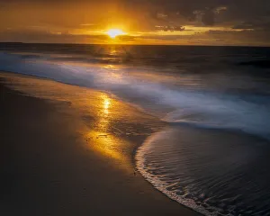 Images Dated 29th April 2021: USA, New Jersey, Cape May National Seashore. Sunrise on ocean and beach