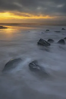 Images Dated 20th April 2022: USA, New Jersey, Cape May National Seashore. Sunrise on rocky shoreline