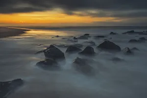 Images Dated 20th April 2022: USA, New Jersey, Cape May National Seashore. Sunrise on rocky shoreline