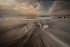 USA, New Jersey, Cape May National Seashore. Cloudy sunrise on seashore