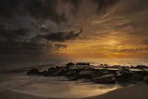 USA, New Jersey, Cape May National Seashore. Cloudy sunset on seashore