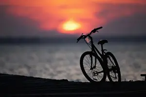 Boardwalk Prints: USA, New Jersey, Seaside Park, Silhouette of bicycle at sunset