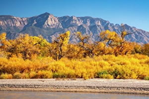 Images Dated 10th May 2024: USA, New Mexico. Rio Grande River and Sandia Mountains in autumn
