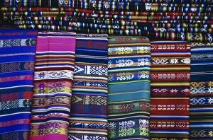 USA, New Mexico, Santa Fe. Display of colorful blankets for sale