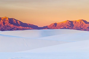 New Mexico Prints: USA, New Mexico, White Sands National Monument. Sunrise on desert sand and mountains