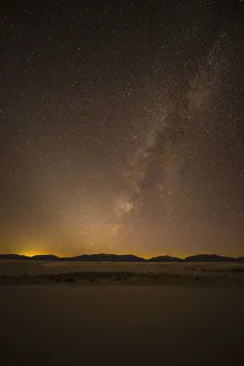 USA, New Mexico, White Sands National Park. Desert and Milky Way at night. Credit as