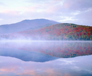 High Prints: USA; New York; Algonquin Peak and autumn colors relecting in a misty Heart Lake in