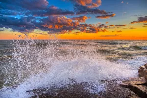 Images Dated 23rd November 2021: USA, New York, Lake Ontario. Sunset waves on rocky shoreline
