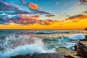 Images Dated 23rd November 2021: USA, New York, Lake Ontario. Sunset waves on rocky shoreline