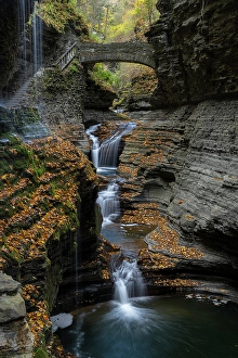 Images Dated 4th May 2024: USA, New York. Series of waterfalls and bridge in Watkins Glen State Park