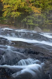 USA, New York State. Buttermilk Falls in autumn, Adirondack Mountains