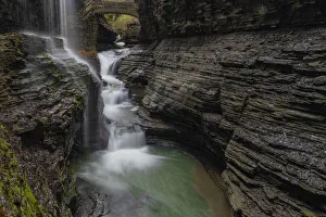 USA, New York, Watkins Glen. Waterfall cascade over rock