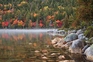 USA; North America, Maine; Acadia National Park; Fall reflections with fog at Jordon pond