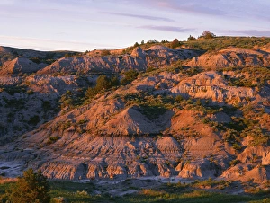 North Dakota Prints: USA, North Dakota, Theodore Roosevelt National Park, Sunset light defines eroded